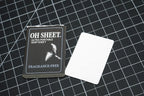 Single use fragrance free paper soap sheet beside sachet